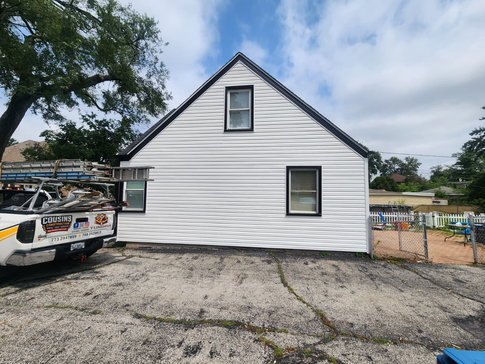Gable end wall finished with new siding and black aluminum trim — Burbank, IL